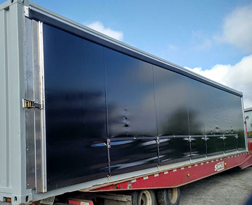 Container with interior curtains