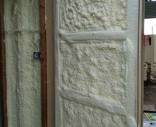 Spray-foam insulation install on container interior at Van Blanc yard